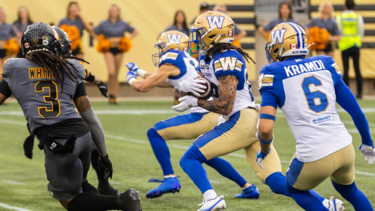 Winnipeg Blue Bombers' Trey Vaval (23) returns a kick during first half CFL football action against the Hamilton Tiger-Cats, in Hamilton on Sunday, July 5, 2026. (Nick Iwanyshyn/CP)