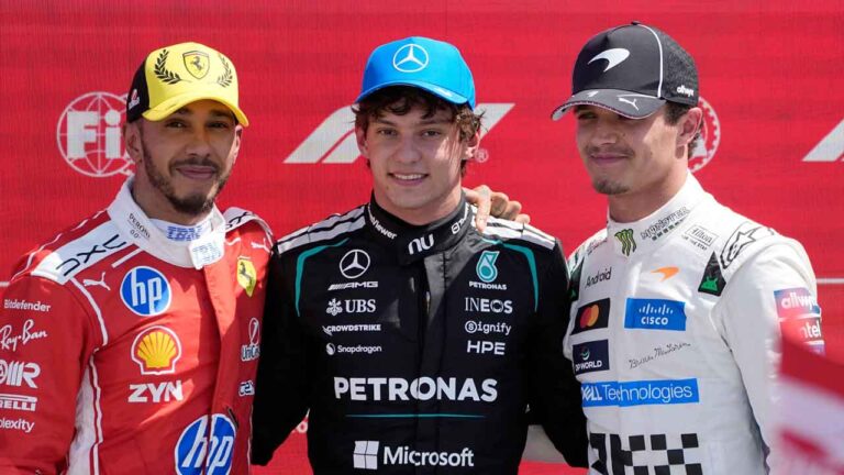 Race winner Mercedes driver Andrea Kimi Antonelli of Italy, center, poses with second placed Ferrari driver Lewis Hamilton of Britain, left, and third placed McLaren driver Lando Norris of Britain after the sprint race at the British F1 Grand Prix, in Silverstone. (Darko Bandic/AP)