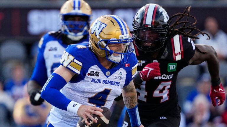 Winnipeg Blue Bombers quarterback Dru Brown (4) runs from Ottawa Redblacks' Luiji Vilain (44) during first half CFL football action in Ottawa, Sunday, July 19, 2026. (Justin Tang/THE CANADIAN PRESS)