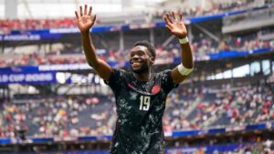 Canada captain Alphonso Davies reacts to the crowd during a World Cup match against South Africa. (Joeran Steinsiek/AP)