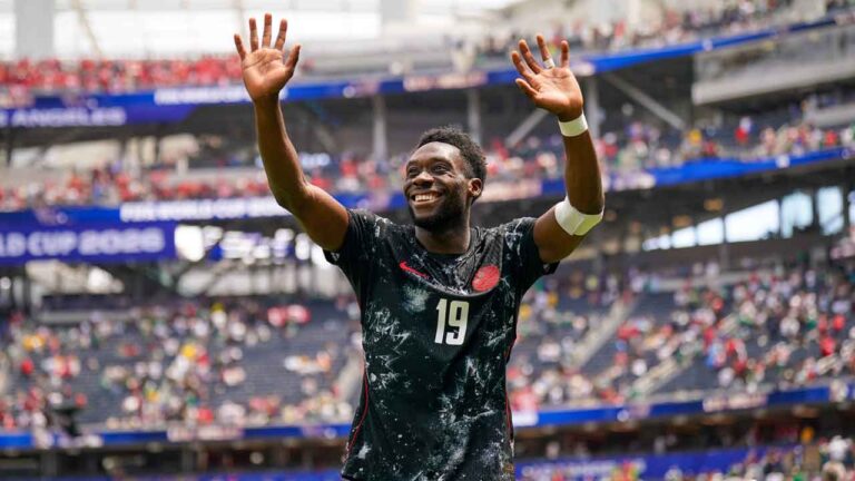 Canada captain Alphonso Davies reacts to the crowd during a World Cup match against South Africa. (Joeran Steinsiek/AP)