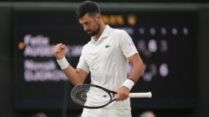 Novak Djokovic of Serbia reacts to winning the third set against Felix Auger-Aliassime of Canada in their quarter-final men's singles match at the Wimbledon Tennis Championships in London, Tuesday, July 7, 2026. (Maja Smiejkowska/AP)