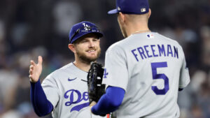 Los Angeles Dodgers third baseman Max Muncy celebrates with Freddie Freeman (5) after defeating the New York Yankees in a baseball game Friday, July 17, 2026, in New York. (Adam Hunger/AP)