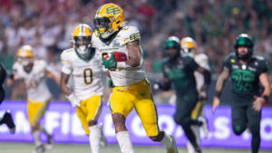 Edmonton Elks running back Javon Leake (22) runs the ball during second half CFL football action against the Saskatchewan Roughriders in Regina on Thursday, July 23, 2026. (Kayle Neis/CP)