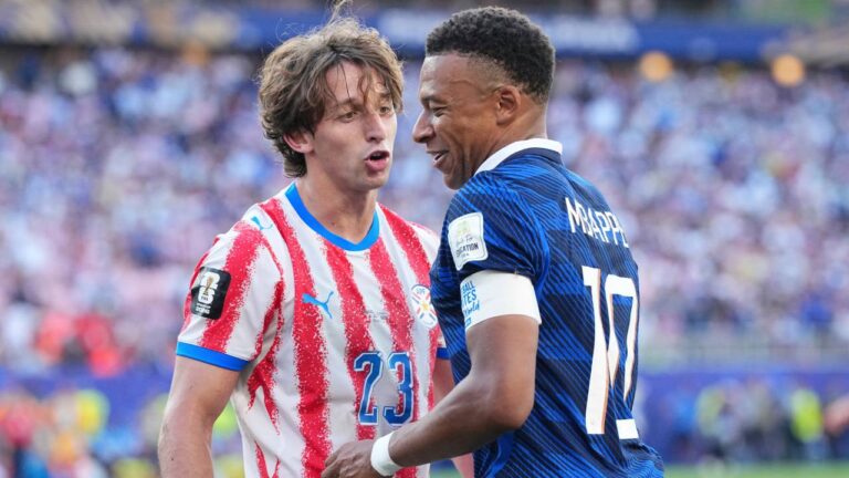 Paraguay's Matias Galarza (23) talks with France's Kylian Mbappe (10) during the World Cup round of 16 soccer match between Paraguay and France in Philadelphia, Saturday, July 4, 2026. (Martin Meissner/AP)