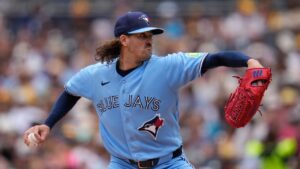 Toronto Blue Jays starting pitcher Kevin Gausman works against a San Diego Padres batter during the first inning of a baseball game Sunday, July 12, 2026, in San Diego. (Gregory Bull/AP Photo)