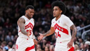 Toronto Raptors guard Chucky Hepburn (24) celebrates a basket against the Boston Celtics with guard Alijah Martin (55) during preseason NBA basketball action in Toronto Friday, October 10, 2025. (Thomas Skrlj/THE CANADIAN PRESS)