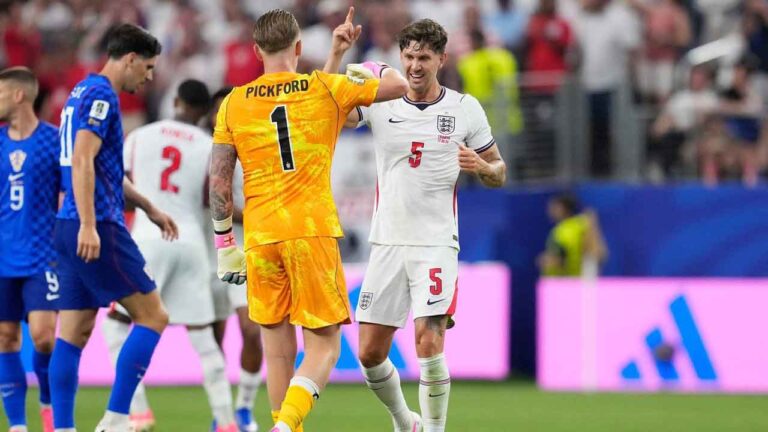 England's John Stones (5) and England goalkeeper Jordan Pickford (1) celebrate their team's fourth goal by England's Marcus Rashford during the World Cup Group L soccer match between England and Croatia in Arlington, Texas. (Tony Gutierrez/AP)