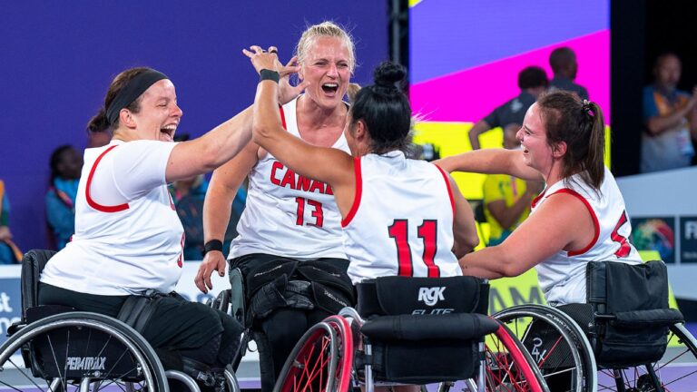 Canada's Tamara Steeves, Kady Dandeneau, Tara Llanes and Elodie Tessier, left to right, celebrate after winning gold in 3 x 3 wheelchair basketball action at the Commonwealth Games in Birmingham, England on Tuesday, Aug. 2, 2022. Canada beat Australia 14-5. (Andrew Vaughan/CP)