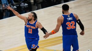 New York Knicks guard Jalen Brunson (11) celebrates a three pointer with centre Karl-Anthony Towns (32) during the second half of Game 2 of the NBA Finals basketball series against the San Antonio Spurs, Friday, June 5, 2026, in San Antonio. (David J. Phillip/AP)