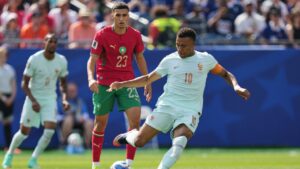 France's Kylian Mbappe (10) makes a pass as Morocco's Bilal El Khannouss (23) looks on during the World Cup quarterfinal soccer match between France and Morocco in Foxborough, Mass., near Boston, Thursday, July 9, 2026. (Stephanie Scarbrough/AP)