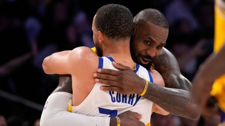 Golden State Warriors guard Stephen Curry, left, and Los Angeles Lakers forward LeBron James hug after the Warriors defeated the Lakers during the second half of an NBA basketball game Thursday, April 3, 2025, in Los Angeles. (Mark J. Terrill/AP)