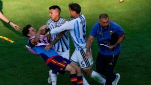 Spain's Gavi, left, falls as he scuffles with Argentina's Leandro Paredes (5) and Thiago Almada during the World Cup final soccer match between Spain and Argentina in East Rutherford, N.J., near New York, Sunday, July 19, 2026. (Yuki Iwamura/AP)