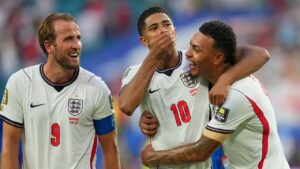 England's Harry Kane, left, Jude Bellingham, centre, and Morgan Rogers celebrate defeating Norway in a World Cup quarterfinal soccer match in Miami Gardens, Fla., Saturday, July 11, 2026. (Julio Cortez/AP)