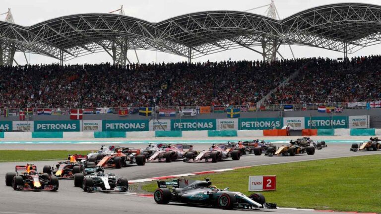 Mercedes driver Lewis Hamilton of Britain leads the filed into turn three at the start of the Malaysian Formula One Grand Prix at the Sepang International Circuit in Sepang, Malaysia. (Vincent Thian/AP)