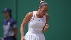 Marta Kostyuk of Ukraine celebrates winning a point against Ashlyn Krueger of the United States in their fourth round women's singles match at the Wimbledon Tennis Championships in London, Monday, July 6, 2026. (Brian Inganga/AP)