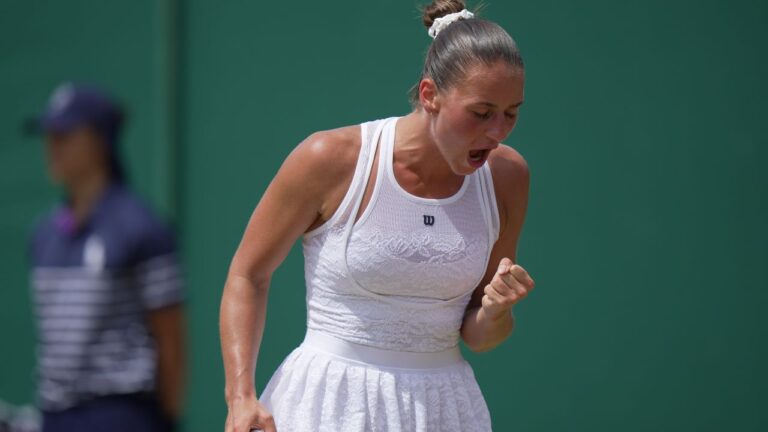 Marta Kostyuk of Ukraine celebrates winning a point against Ashlyn Krueger of the United States in their fourth round women's singles match at the Wimbledon Tennis Championships in London, Monday, July 6, 2026. (Brian Inganga/AP)