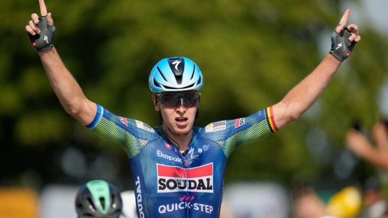 Belgium's Tim Merlier celebrates as he crosses the finish line to win the eighth stage of the Tour de France cycling race with start in Perigueux and finish in Bergerac, France, Saturday, July 11, 2026. (Mosa'ab Elshamy/AP)