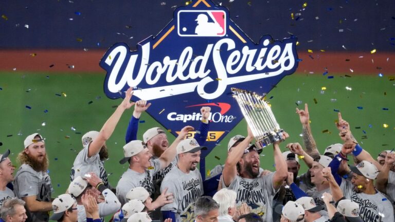 Los Angeles Dodgers Clayton Kershaw holds the trophy as the Dodgers celebrate their win in Game 7 of baseball's World Series against the Toronto Blue Jays, Sunday, Nov. 2, 2025, in Toronto. (Ashley Landis/AP)