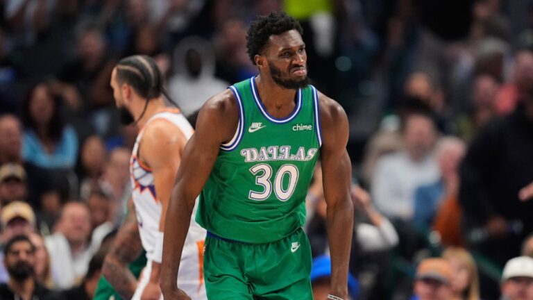 Dallas Mavericks' Moussa Cisse (30) celebrates after sinking a basket in the first half of an NBA basketball game against the Phoenix Suns Thursday,Nov. 13, 2025, in Dallas. (Tony Gutierrez/AP)