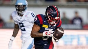 Montreal Alouettes' Tyson Philpot (6) makes the catch and runs in for a touchdown in front of Toronto Argonauts' Tarvarus McFadden (2) during second half CFL football action in Montreal on Friday, June 12, 2026. (Christinne Muschi/THE CANADIAN PRESS)