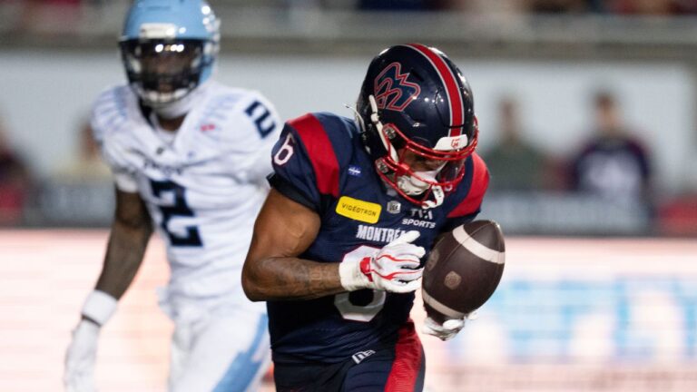 Montreal Alouettes' Tyson Philpot (6) makes the catch and runs in for a touchdown in front of Toronto Argonauts' Tarvarus McFadden (2) during second half CFL football action in Montreal on Friday, June 12, 2026. (Christinne Muschi/THE CANADIAN PRESS)