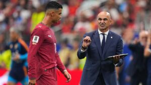 Portugal head coach Roberto Martinez, right, gives instructions to Cristiano Ronaldo (7) during the World Cup round of 16 soccer match between Portugal and Spain in Arlington, Texas, near Dallas, Monday, July 6, 2026. (Julio Cortez/AP)