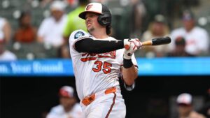 Baltimore Orioles catcher Adley Rutschman (35) follows through on a RBI single against the Chicago White Sox in the fifth inning of a baseball game on Wednesday, July 1, 2026 in Baltimore. (Gail Burton/AP)