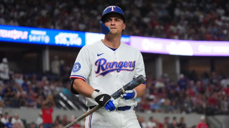 Texas Rangers' Corey Seager heads to the dugout after hitting into an unassisted double play flyout with teammate Kyle Higashioka out at first base during the sixth inning of a baseball game against the Cleveland Guardians, Saturday, June 6, 2026, in Arlington, Texas. (LM Otero/AP)