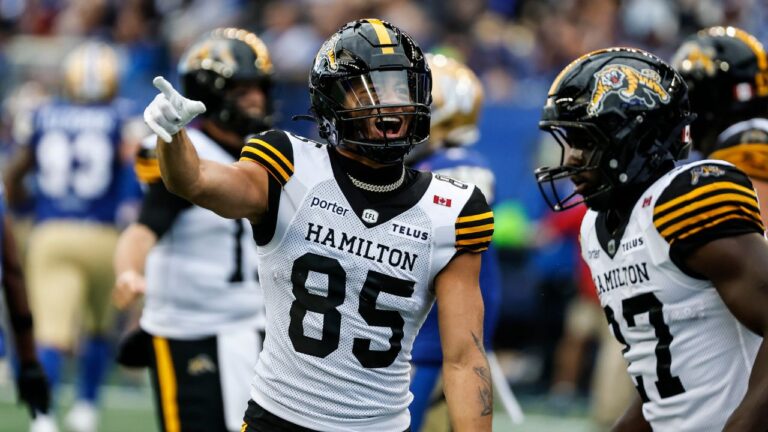 Hamilton Tiger-Cats' Kiondre Smith (85) celebrates his touchdown against the Winnipeg Blue Bombers during first half CFL football action in Winnipeg on Thursday, June 11, 2026. (John Woods/THE CANADIAN PRESS)