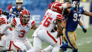 Calgary Stampeders quarterback Vernon Adams Jr. (3) hands off to Dedrick Mills (26) during first half CFL football action against the Winnipeg Blue Bombers in Winnipeg on Friday, July 24, 2026. (John Woods/CP)