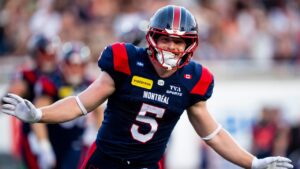 Montreal Alouettes' Travis Theis (5) celebrates his touchdown against Calgary Stampeders during first half CFL football action in Montreal on Saturday, July 11, 2026. (Christopher Katsarov/THE CANADIAN PRESS)