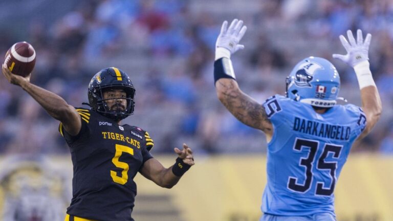 Hamilton Tiger-Cats quarterback Tre Ford attempts a pass during the during first half CFL football action against the Toronto Argonauts, in Hamilton, Saturday, July 18, 2026. (Michael P. Hall/CP)
