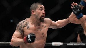 Australia's Robert Whittaker, left, and Reinier de Ridder of the Netherlands fight during a UFC middleweight bout on Sunday, July 27, 2025, in Abu Dhabi, United Arab Emirates. (Fatima Shbair/AP)