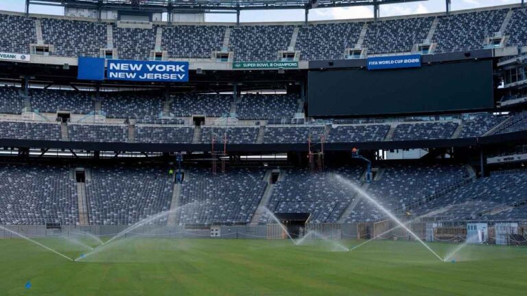 FILE - Sprinklers water the grass during the pitch installation for FIFA World Cup 2026 at NYNJ Stadium. (Yuki Iwamura/AP)