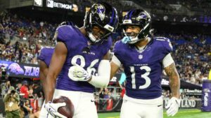 Baltimore Ravens wide receiver Cornelius Johnson (86) celebrates with Elijah Sarratt (13) after catching a touchdown pass against the Washington Commanders during the second half of an NFL preseason football game, Friday, Aug. 28, 2026, in Baltimore. (Nick Wass/AP)