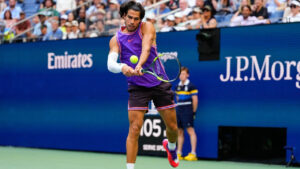 Carlos Alcaraz, of Spain, returns the ball during a mixed doubles match at the U.S. Open tennis championships, Tuesday, Aug. 25, 2026, in New York. (Yuki Iwamura/AP)