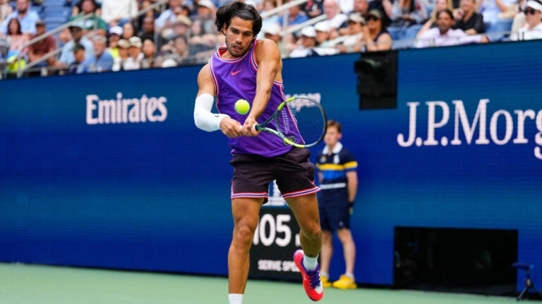 Carlos Alcaraz, of Spain, returns the ball during a mixed doubles match at the U.S. Open tennis championships, Tuesday, Aug. 25, 2026, in New York. (Yuki Iwamura/AP)