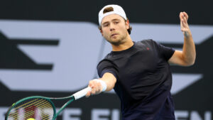 Aleksandar Kovacevic, of the United States, plays a shot during his semifinal match against Brandon Nakashima, of the United States, at the Brisbane International tennis tournament in Brisbane, Australia, Saturday, Jan. 10, 2026. (Tertius Pickard/AP)