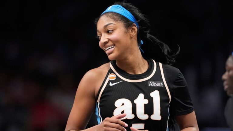 Atlanta Dream forward Angel Reese (5) laughs in the second half of an WNBA basketball game against the Indiana Fever Sunday, Aug. 16, 2026, in Atlanta. (Brynn Anderson/AP)