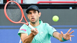 Nuno Borges of Portugal plays a shot to Aleksandar Kovacevic of the United States during their first round match at the National Bank Open tennis tournament in Montreal, on Monday, Aug. 3, 2026. (Graham Hughes/CP)
