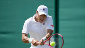 Brandon Nakashima of the United States plays a backhand against Jan-Lennard Struff of Germany in their second round men's singles match at the Wimbledon Tennis Championships in London, Thursday, July 2, 2026. (Brian Inganga/AP)