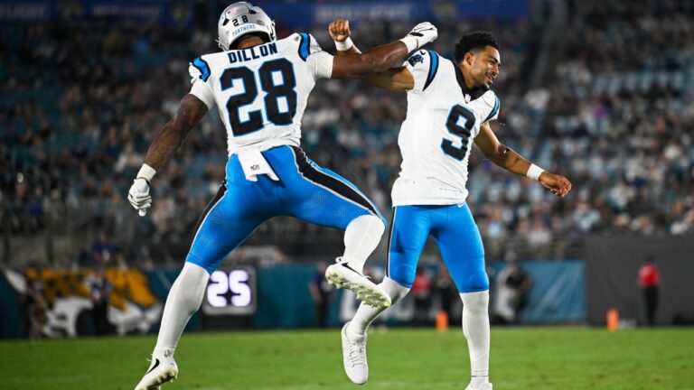 Carolina Panthers running back AJ Dillon celebrates after scoring with quarterback Bryce Young during the first half of an NFL preseason football game against the Jacksonville Jaguars, Friday, Aug. 21, 2026, in Jacksonville, Fla. (AP Photo/Phelan M. Ebenhack)