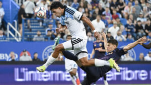 LA Galaxy's Harbor Miller, right, defends against CF Montreal's Daniel Rios during first half MLS soccer action in Montreal, on Saturday, August 22, 2026. (Graham Hughes/CP)