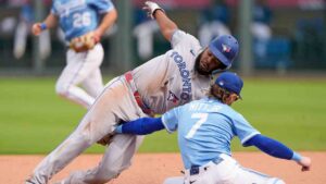Toronto Blue Jays' Vladimir Guerrero Jr., left, is caught stealing second by Kansas City Royals shortstop Bobby Witt Jr. (7) during the seventh inning of a baseball game, Sunday, Sept. 21, 2025, in Kansas City, Mo. (Charlie Riedel/AP)