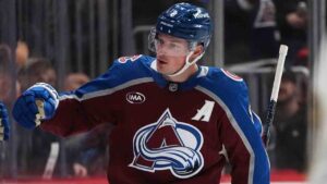 Colorado Avalanche defenseman Cale Makar (8) is congratulated as he passes the team box after scoring a goal against the Ottawa Senators in the second period of an NHL hockey game Thursday, Jan. 8, 2026, in Denver. (David Zalubowski/AP)