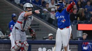 Cleveland Guardians catcher Austin Hedges, left, and Toronto Blue Jays infielder Vladimir Guerrero Jr. both appeal to the first base umpire on a check swing by Guerrero Jr in sixth inning MLB baseball game action in Toronto on Sunday, April 26, 2026. (Jon Blacker/CP)