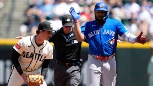 Toronto Blue Jays' Vladimir Guerrero Jr., right, reacts to hitting a double as Seattle Mariners second baseman Cole Young looks on during the first inning of a baseball game, Sunday, July 5, 2026, in Seattle. (Lindsey Wasson/AP)