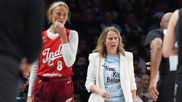 Indiana Fever guard Sophie Cunningham (8) and Minnesota Lynx head coach Cheryl Reeve, right, stand on the court during the first half of a WNBA basketball game Sunday, Aug. 2, 2026, in Minneapolis. (AP Photo/Abbie Parr)