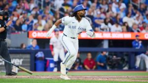 Toronto Blue Jays' Charles McAdoo (26) rounds the bases after hitting a home run against the Boston Red Sox during fifth inning MLB baseball action in Toronto, on Monday, Aug. 10, 2026. (Sammy Kogan/CP)